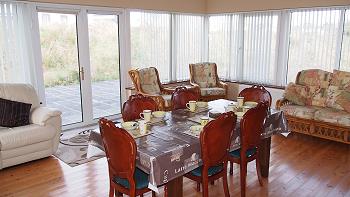 Dining table, more comfortable seating options at rear